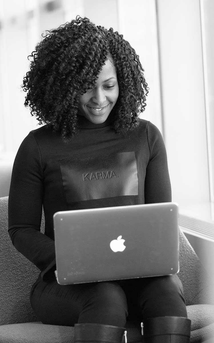 Woman typing on a laptop
